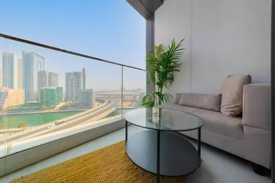 a living room with a couch and a glass table at EDEN'S Homes & Villas - ADDRESS BEACH Residences JBR in Dubai