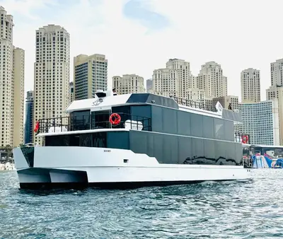 a large boat in the water in front of a city at Boat Camping in Dubai