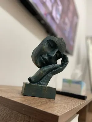 a statue of a woman sitting on a table at Private gorgeous Room with Marina view with Shared Kitchen in Shared Apartment in Dubai