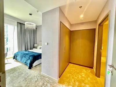 a hotel room with a bed and a hallway at Ultimate Luxury at Dubai Creek Horizon Waterfront in Dubai
