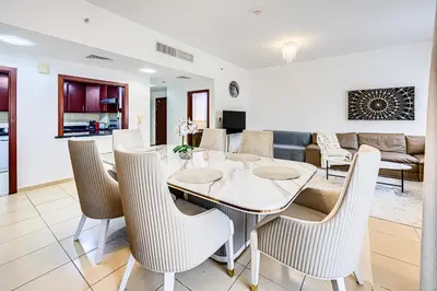 a dining room with a table and chairs at Wonderful 2 Bedroom apartment in JBR in Dubai