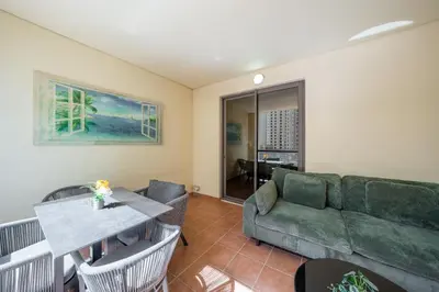 a living room with a couch and a table at Magic waves holiday in Dubai