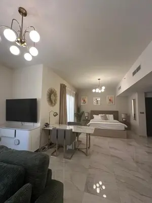 a large living room with a bed and a couch at Magic waves holiday in Dubai