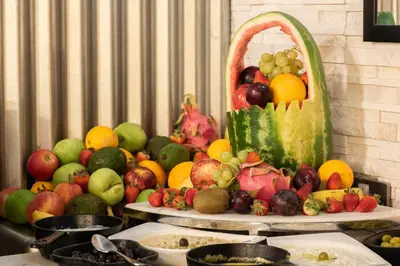 a display of fruits and vegetables on a table at Grandeur Hotel Al Barsha in Dubai