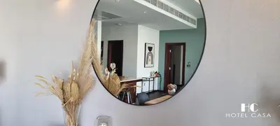 a mirror hanging on a wall in a room at Palm Jumeirah 1BR luxurious & gorgeous view in Dubai