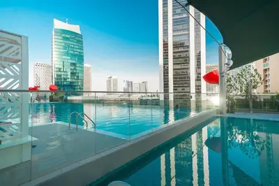 a swimming pool with a view of a city skyline at Frank Porter - MAG 318 in Dubai