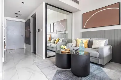 a living room with a couch and a table at Frank Porter - MAG 318 in Dubai