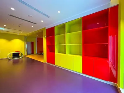 a brightly colored room with colorful shelves at AWS Holiday Homes - Panoramic Canal View in Dubai