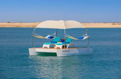 a small boat in the middle of the water at Anantara World Islands Dubai Resort in Dubai