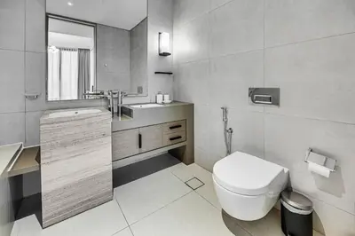 a bathroom with a toilet and a sink at Brand New 5* Luxury Apartment in Address JBR in Dubai