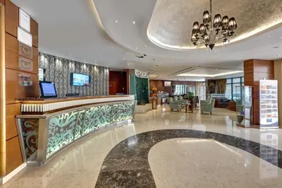 a lobby with a bar in a hotel at Orchid Hotel Al Barsha 
