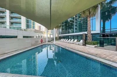 a swimming pool in the middle of a building at Frank Porter - The Address JBR in Dubai