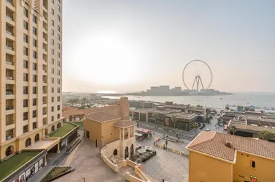 an aerial view of a city with the ferris wheel at Elan Rimal 5 Suites in Dubai