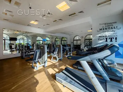 a gym with cardio machines and treadmills at Fairmont Apartments The Palm, Free access to hotel beach and pools in Dubai