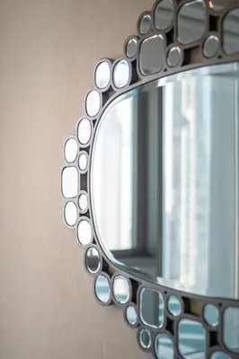 a mirror on the side of a wall at BellaVista - Sophisticated - 2 BR - 29 Boulevard - Burj Khalifa & Fountain View in Dubai