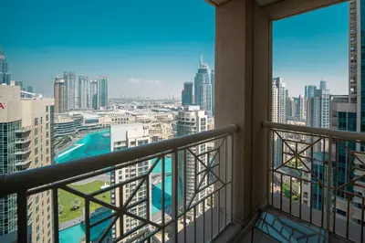 a balcony with a view of a city at BellaVista - Sophisticated - 2 BR - 29 Boulevard - Burj Khalifa & Fountain View in Dubai
