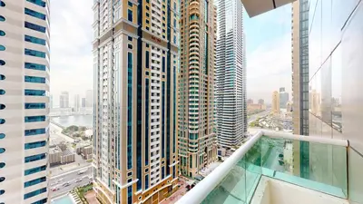 a view of a city from the balcony of a skyscraper at MP12 - Luxurious 2BR in Marina Pinnacle Tower in Dubai