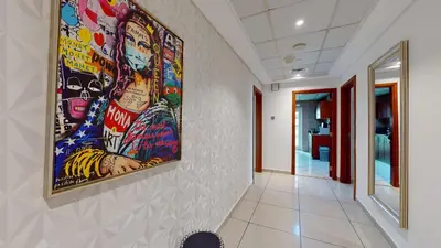 a hallway with a large painting on the wall at MP12 - Luxurious 2BR in Marina Pinnacle Tower in Dubai