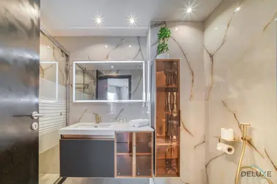 a bathroom with a sink and a mirror at Classy 2BR at La Riviera Dubai Marina by Deluxe Holiday Homes in Dubai