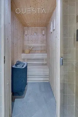 a sauna with a toilet and a tub in a building at LIV Residence, Dubai Marina in Dubai