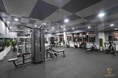 a gym with several treadmills and machines in a room at Dubai marina , Success Luxury apartments, near JBR beach and metro station-daily free housekeeping included in Dubai