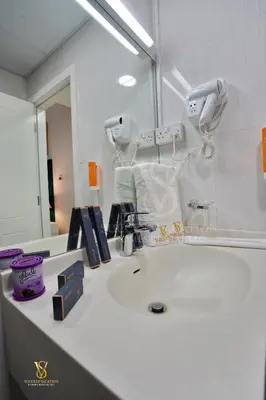 a bathroom with a sink and a mirror at Dubai marina , Success Luxury apartments, near JBR beach and metro station-daily free housekeeping included in Dubai