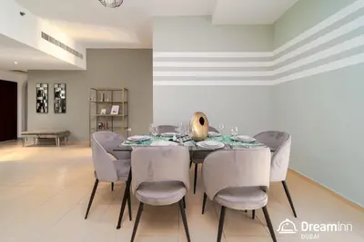 a dining room with a table and chairs at Dream Inn Apartments - Rimal JBR in Dubai