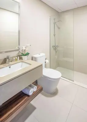 a bathroom with a toilet and a sink and a shower at Silkhaus newly furnished modern DIFC studio with balcony in Dubai