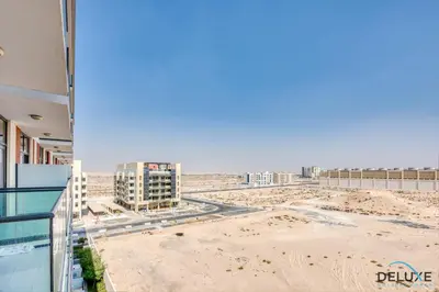 a view of the beach from the balcony of a building at Restful Studio at Celestia A Dubai South by Deluxe Holiday Homes in Dubai