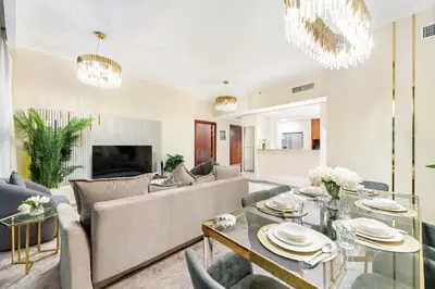 a living room with a couch and a table at Luxury 2BR Skyline Sea View Direct Mall Metro Dining Shops City Walk in Dubai