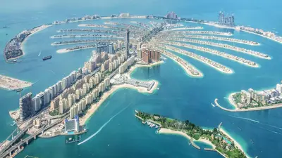 an aerial view of a city with a marina at HVR THE PALM DUBAI in Dubai