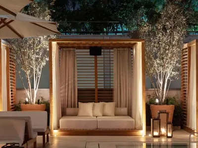 a living room with a white couch in front of a window at The Dubai EDITION in Dubai