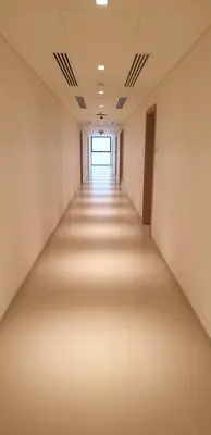 an empty corridor in an office building at Elite Inn: Parkridge904 in Dubai