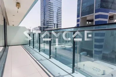 a glass balcony with views of the city at Staycae Holiday Homes - Merano in Dubai