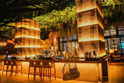 a bar in a restaurant with chairs and tables at Ramee Dream Hotel Downtown in Dubai