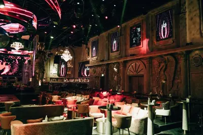 a restaurant with tables and chairs in a room at Ramee Dream Hotel Downtown in Dubai