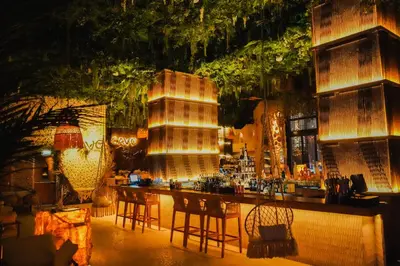 a bar with tables and chairs in a room at Ramee Dream Hotel Downtown in Dubai