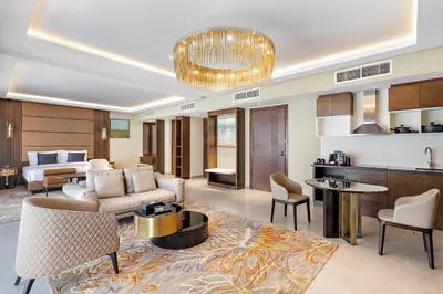 a living room with a couch and a table at Ramee Dream Hotel Downtown in Dubai