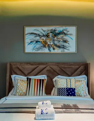 a bedroom with a bed with towels on it at Luxury Escapes - Large Studio in the heart of Dubai Marina - West Avenue in Dubai