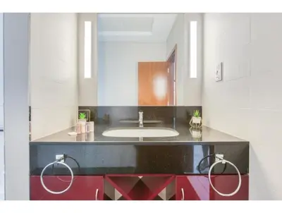 a bathroom with a sink and a counter with a mirror at THE PENTHOUSE near Burj Khalifa and Dubai Mall in Dubai