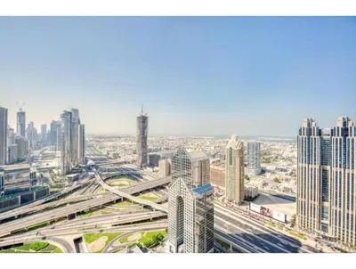 an aerial view of a city with many tall buildings at THE PENTHOUSE near Burj Khalifa and Dubai Mall in Dubai