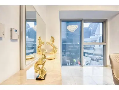 a statue of a woman in a room with numbers at THE PENTHOUSE near Burj Khalifa and Dubai Mall in Dubai