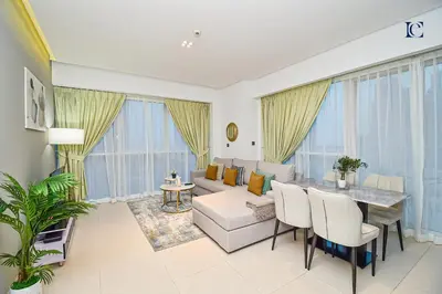 a living room with a couch and a table at Luxury Escapes - 1BR Apt with Balcony - West Avenue Marina in Dubai