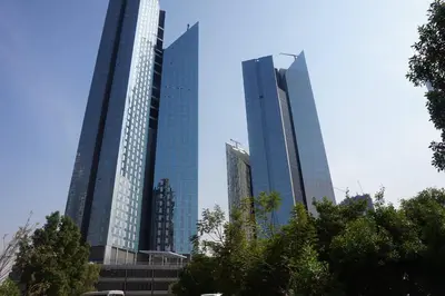 a group of tall buildings in a city at Hometown Apartments - Cosy 1 Br Apartment with Brand New Furniture in DIFC in Dubai