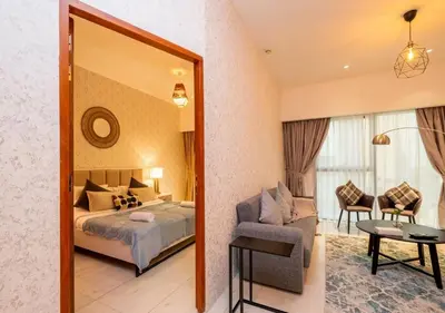 a hotel room with a bed and a mirror at Hometown Apartments - Cosy 1 Br Apartment with Brand New Furniture in DIFC in Dubai