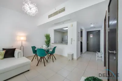 a living room with a couch and a table at Full Marina and Ain Dubai Wheel View 1BR at The Point Dubai Marina by Deluxe Holiday Homes in Dubai