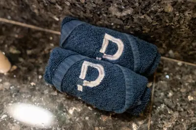 a pair of gloves with the letters p on them at Welcoming 1 Bedroom Palm Jumeirah with sea View in Dubai