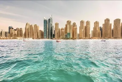 a view of a city from the water with buildings at Luxury Apartments in Dubai marina in Dubai