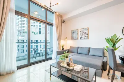 a living room with a couch and a large window at Captivating 1BR at DEC Towers Dubai Marina by Deluxe Holiday Homes in Dubai