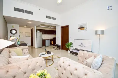a living room with two couches and a tv at Luxury Escapes - 1BR Home with Stunning Marina View - Bay Central Marina in Dubai